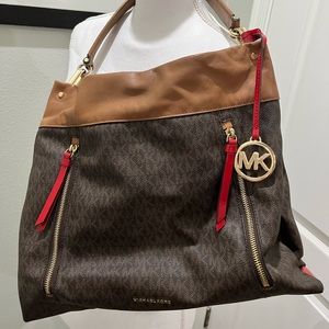 Michael Kors handbag with red patent leather accents.